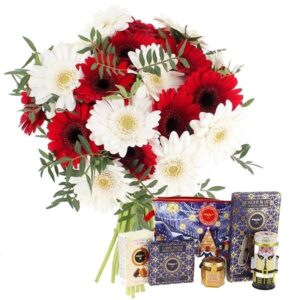 Bouquet de germinis rouges et blancs avec trousse gourmande de Noël Florajet disponible sur le comparateur bloomyrama