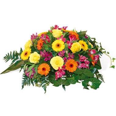 Composition de deuil avec gerberas roses et alstroemerias colorés feuillage vert L'Agitateur Floral disponible sur bloomyrama