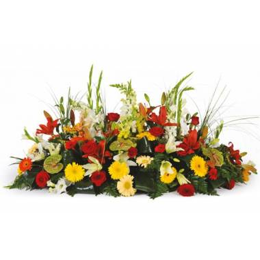 Composition de deuil colorée avec lys gerberas roses et anthuriums verts L'Agitateur Floral vu sur bloomyrama