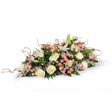 Composition de deuil rose et blanche avec lys roses et gypsophile L'Agitateur Floral vu sur bloomyrama