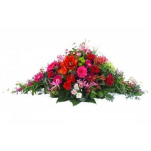 Raquette de deuil rouge et fuchsia avec roses gerberas et santinis L'Agitateur Floral vu sur bloomyrama