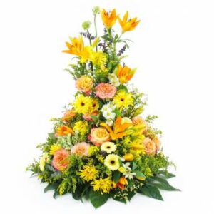 coussin de deuil jaune orange en hauteur avec roses lys gerberas et feuillage Agitateur Floral disponible sur bloomyrama