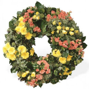 Couronne de deuil rose et jaune avec roses gerberas et oeillets 80 cm l’Agitateur Floral disponible sur le comparateur bloomyrama